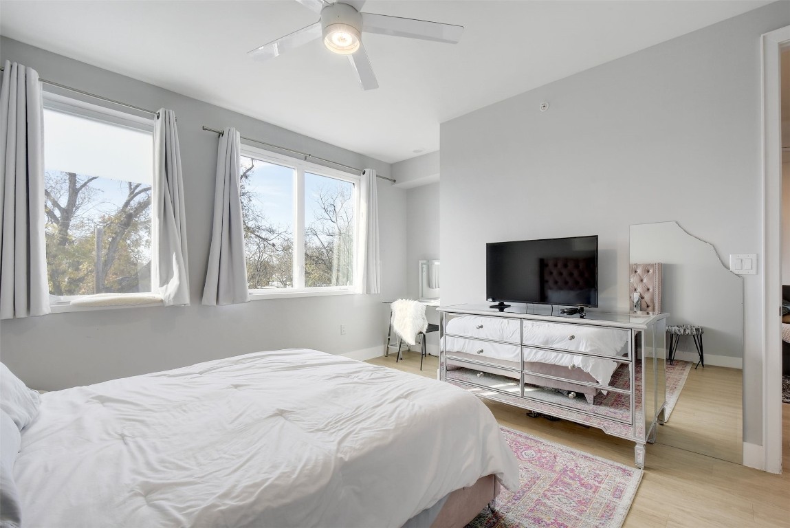 2709 East 5th Street, Unit 2303 Austin, TX 78702 - Photo 10 of 18 a bedroom with bed tv and window