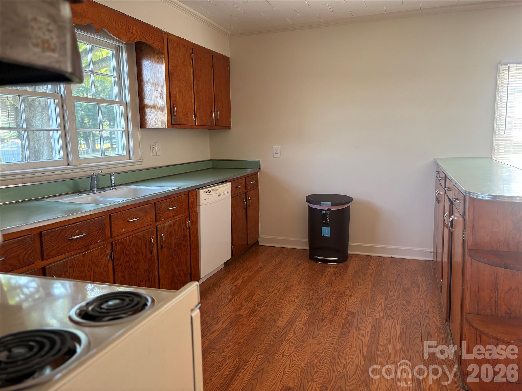 6625 Long Road Matthews, NC 28104 - Photo 8 of 21 a kitchen with a refrigerator and a stove