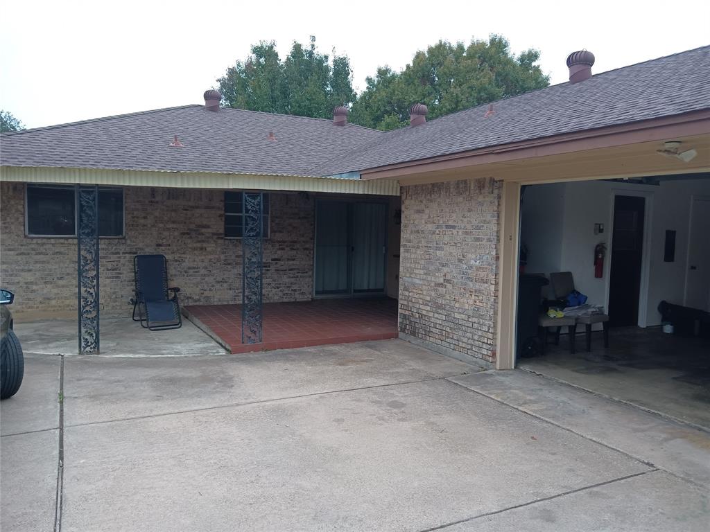 1113 Janell Drive Irving, TX 75062 - Photo 25 of 25 a front view of a house with garden