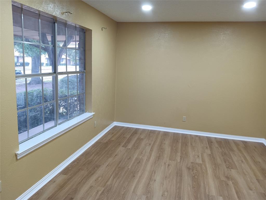 1113 Janell Drive Irving, TX 75062 - Photo 4 of 25 a view of wooden floor in a room