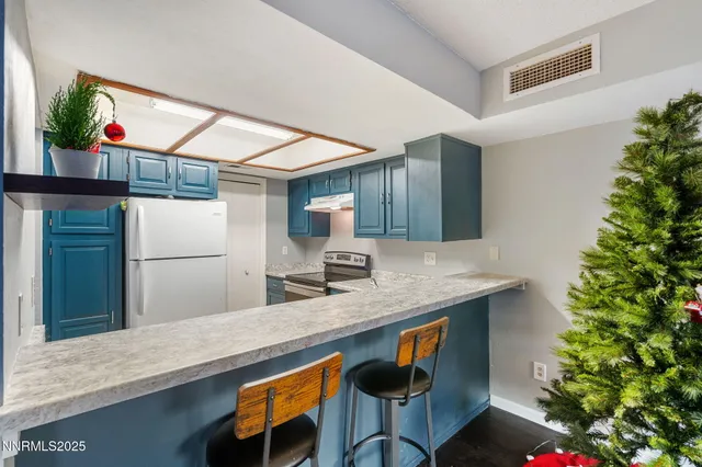 a kitchen with a table and chairs in it