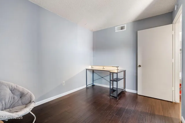 a view of workspace with wooden floor