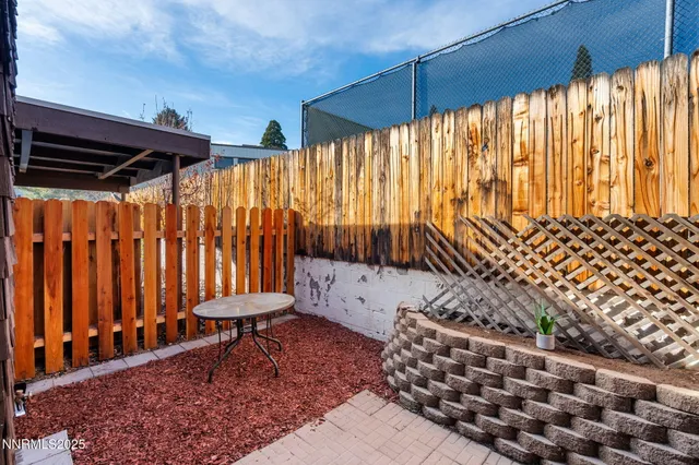 a bathroom with a toilet and shower curtain