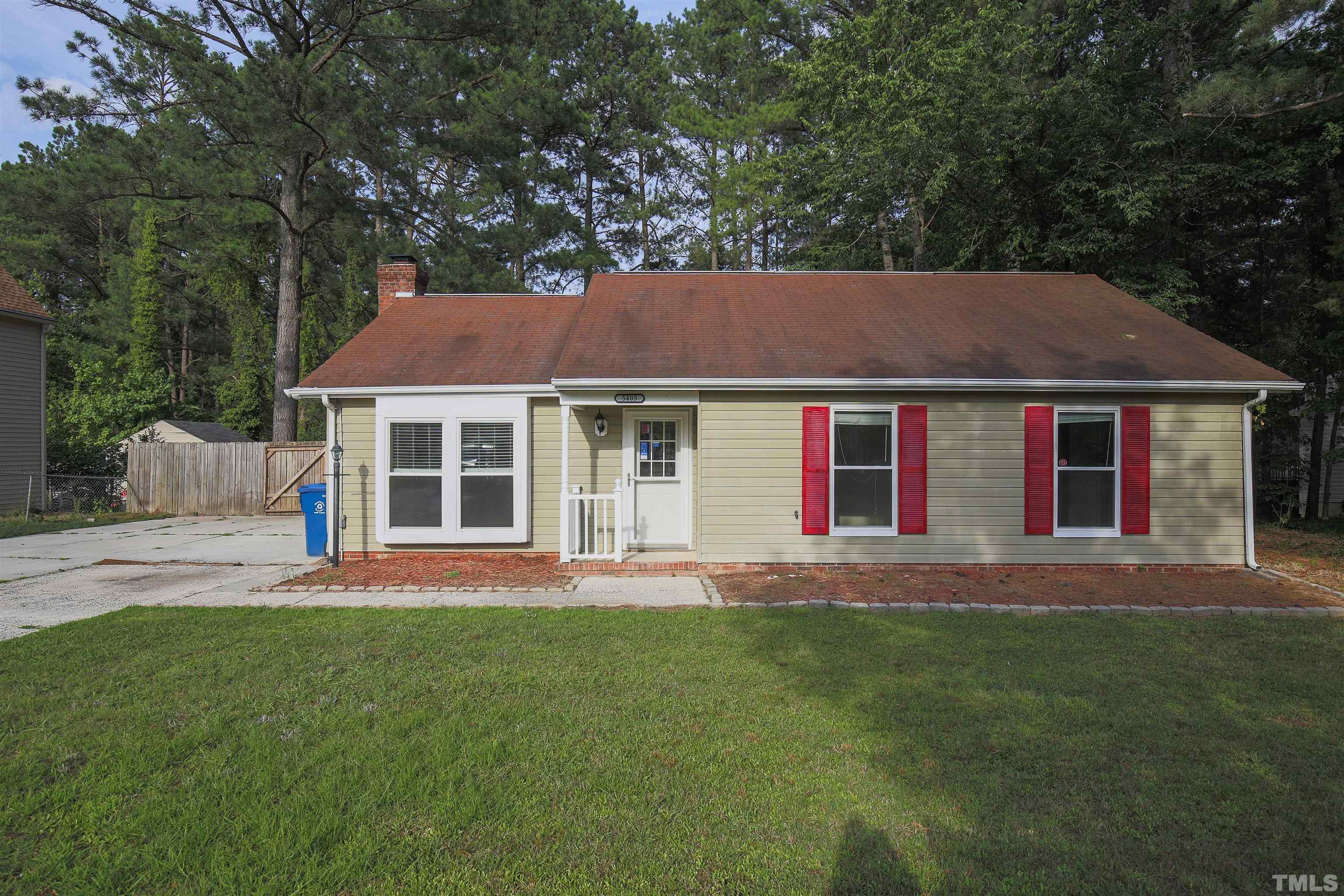 5405 Barbee Road Durham, NC 27713 - Photo 1 of 17 a front view of a house with a garden