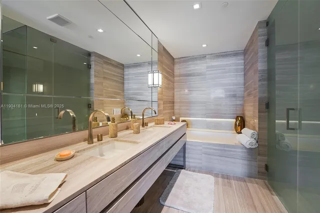 a bathroom with a bathtub and a sink