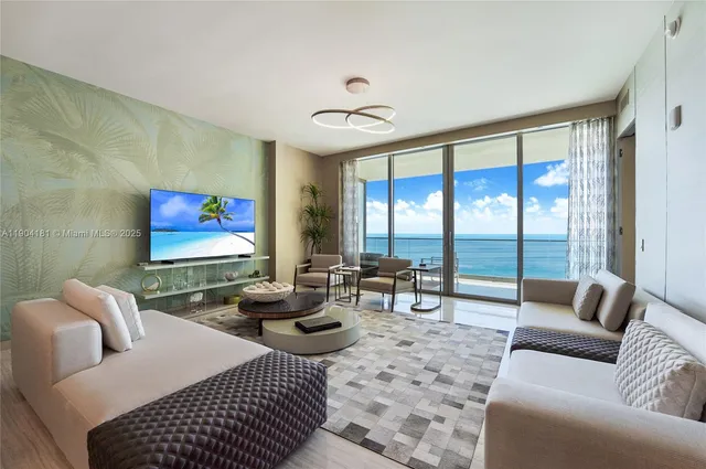 a living room with furniture a rug and a large window