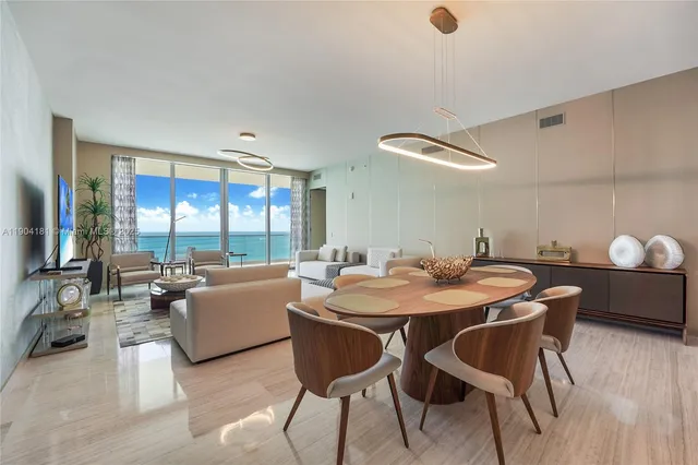 a dining room with furniture and window