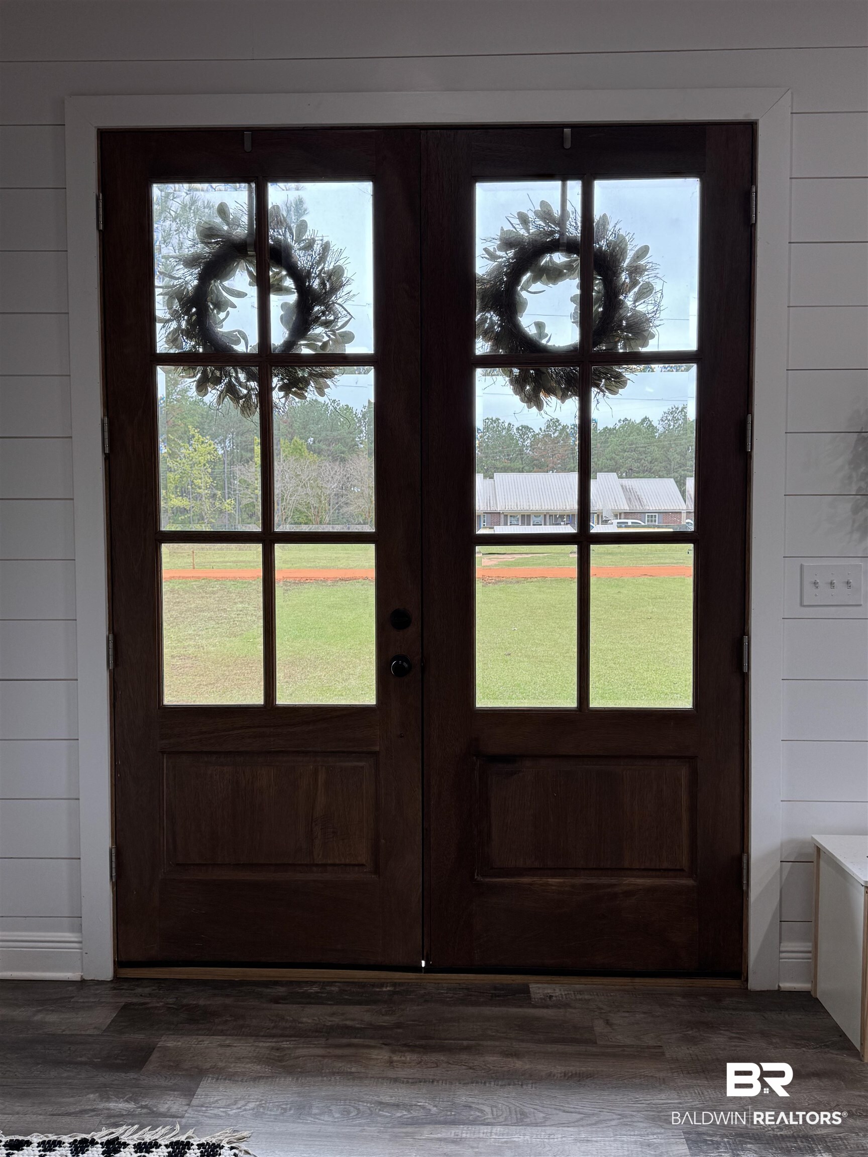 370 Dianne Road Frisco City, AL 36445 - Photo 41 of 41 Doorway to outside with wood walls, wood-type flooring, and french doors