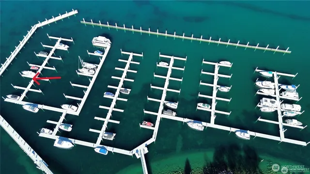 a view of a two chairs in the park