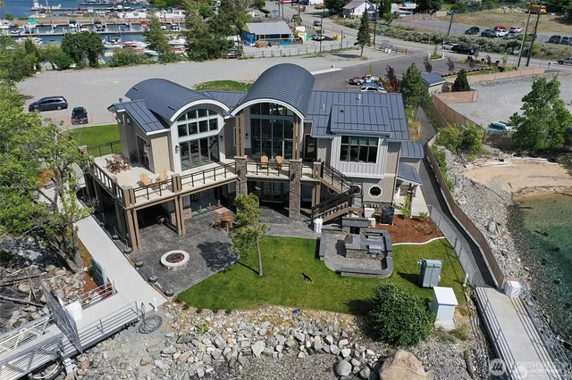 a living room with furniture a flat screen tv and a large window