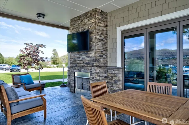 a living room with furniture fireplace and a flat screen tv