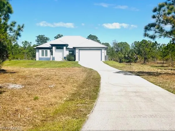 a front view of a house with yard