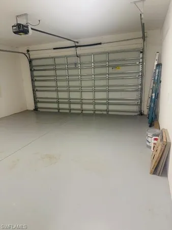 a kitchen with stainless steel appliances refrigerator and microwave