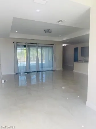a kitchen with stainless steel appliances granite countertop a refrigerator and a stove