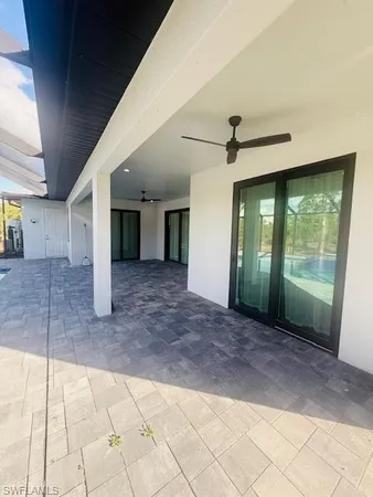 a view of a house with backyard and porch