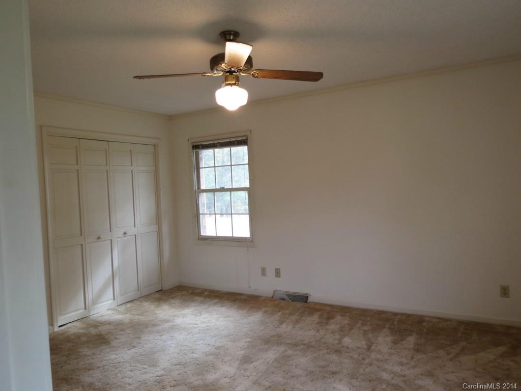 4655 Percival Road Rock Hill, SC 29730 - Photo 12 of 14 an empty room with windows and fan