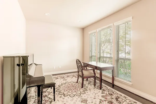 a view of a livingroom with furniture and a window