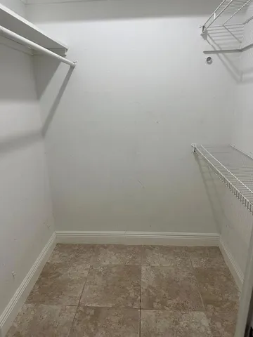 a view of a room with racks on the wall