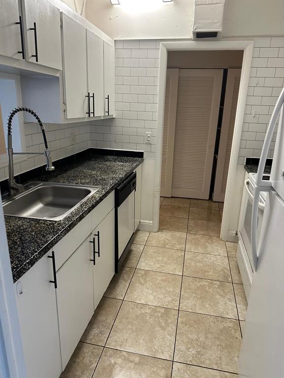 400 North Riverside Drive, Unit 102 102 Pompano Beach, FL 33062 - Photo 2 of 20 a kitchen with granite countertop a sink a stove and a granite counter tops