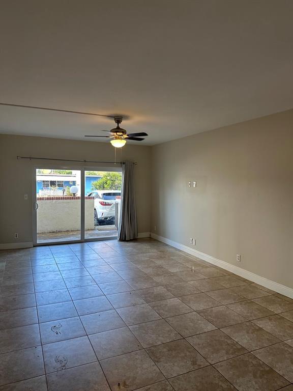 400 North Riverside Drive, Unit 102 102 Pompano Beach, FL 33062 - Photo 7 of 20 a view of empty room with window and fireplace