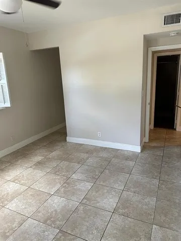 a view of an empty room and window