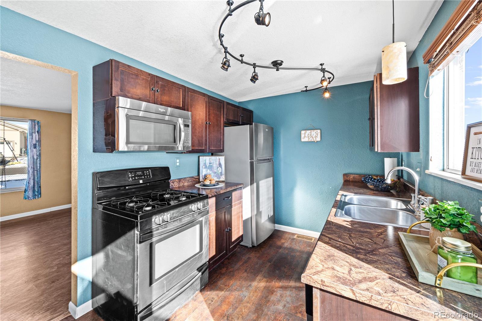 3126 County Rd CC254 Colorado City, CO 81019 - Photo 16 of 50 a kitchen with stainless steel appliances granite countertop a stove and a sink