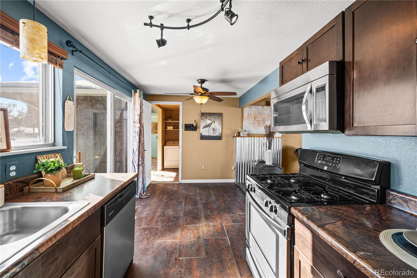 3126 County Rd CC254 Colorado City, CO 81019 - Photo 18 of 50 a kitchen with stainless steel appliances granite countertop a sink stove and cabinets