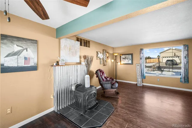 a view of a hallway with wooden floor and glass door