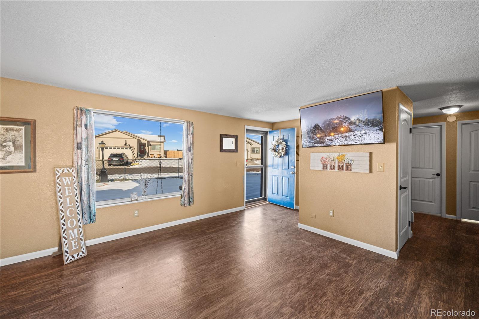 3126 County Rd CC254 Colorado City, CO 81019 - Photo 20 of 50 a view of a livingroom with wooden floor and cabinet