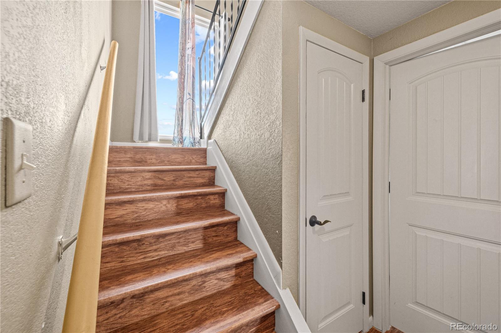 3126 County Rd CC254 Colorado City, CO 81019 - Photo 23 of 50 a view of staircase with railing and white walls