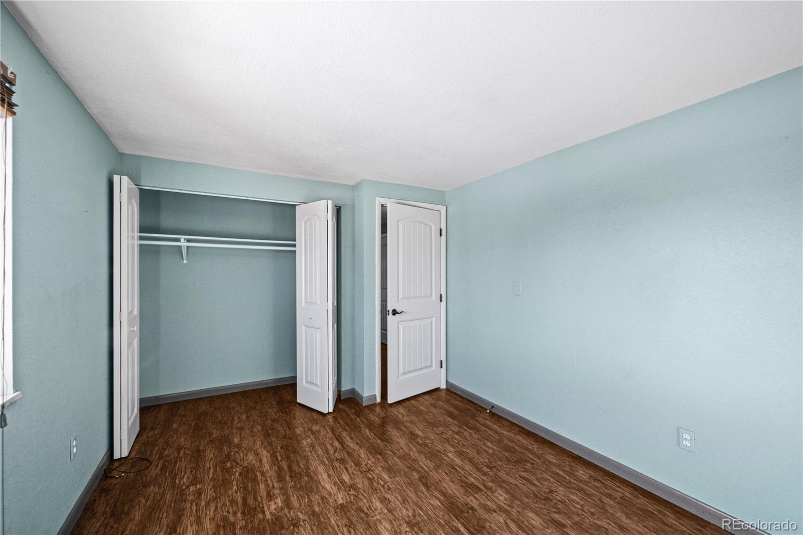 3126 County Rd CC254 Colorado City, CO 81019 - Photo 27 of 50 a view of a room with wooden floor and a window