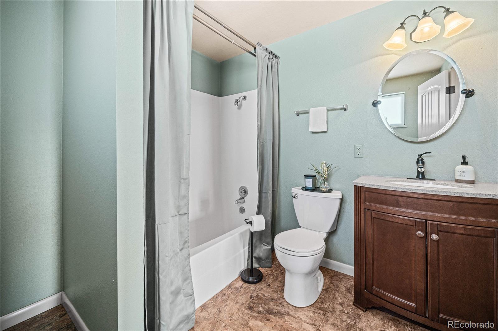 3126 County Rd CC254 Colorado City, CO 81019 - Photo 32 of 50 a bathroom with a toilet a sink and a mirror