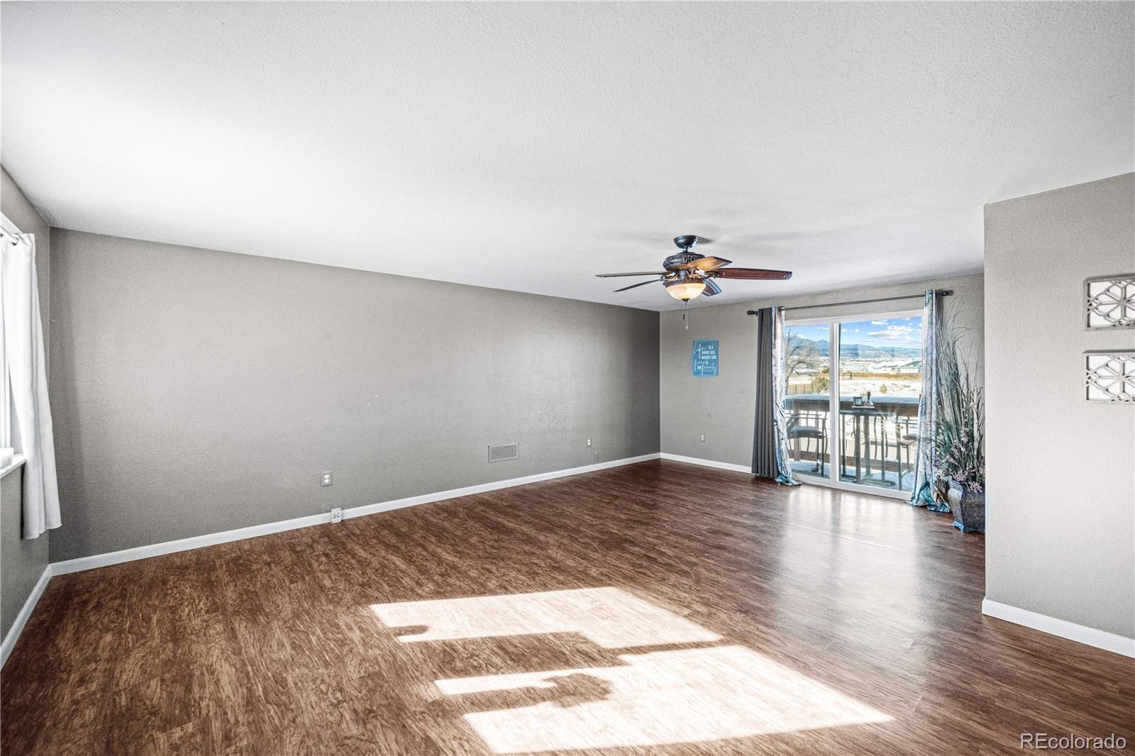 3126 County Rd CC254 Colorado City, CO 81019 - Photo 33 of 50 a view of an empty room with wooden floor and a window