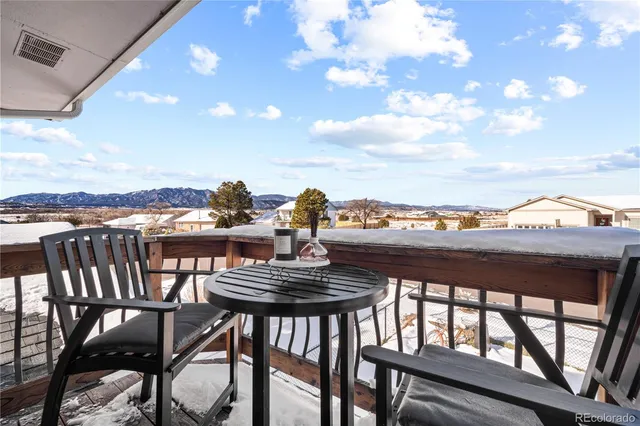 a view of a terrace with chairs