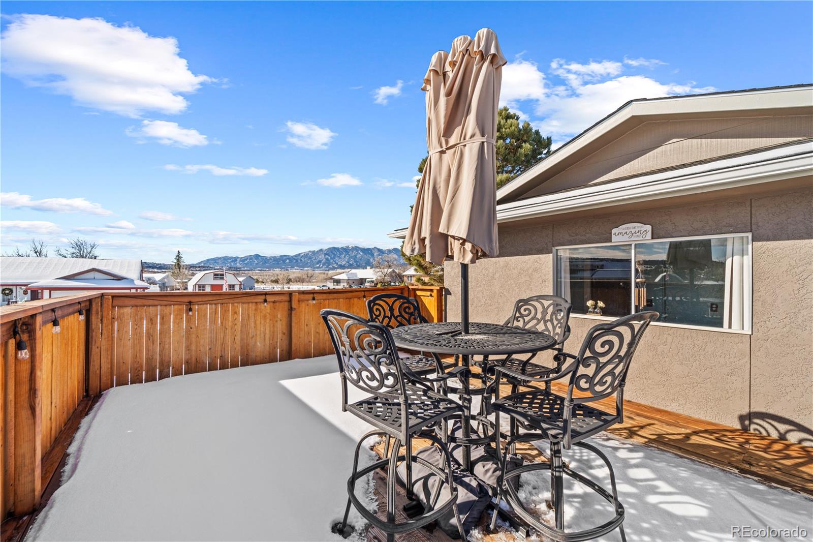 3126 County Rd CC254 Colorado City, CO 81019 - Photo 42 of 50 a view of a roof deck with table and chairs