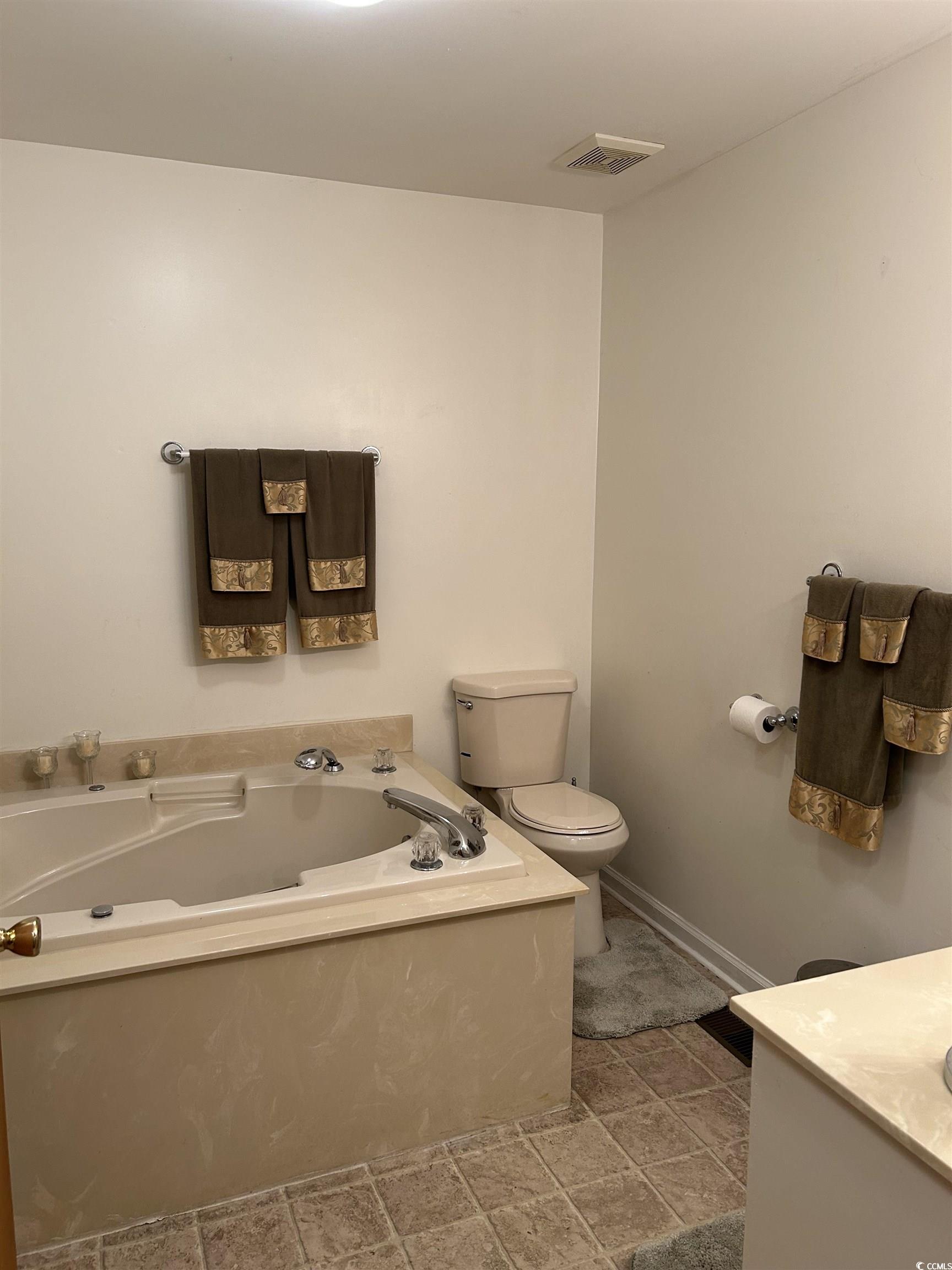 1411 East Harrison Street Dillon, SC 29536 - Photo 22 of 40 Full bath with vanity and a bath