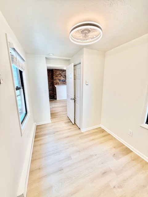7 Tileston Street, Unit 2 Boston, MA 02113 - Photo 12 of 12 a view of a hallway with wooden floor and furniture