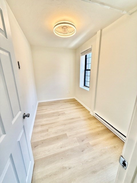 7 Tileston Street, Unit 2 Boston, MA 02113 - Photo 6 of 12 a view of a room with wooden floor and white walls