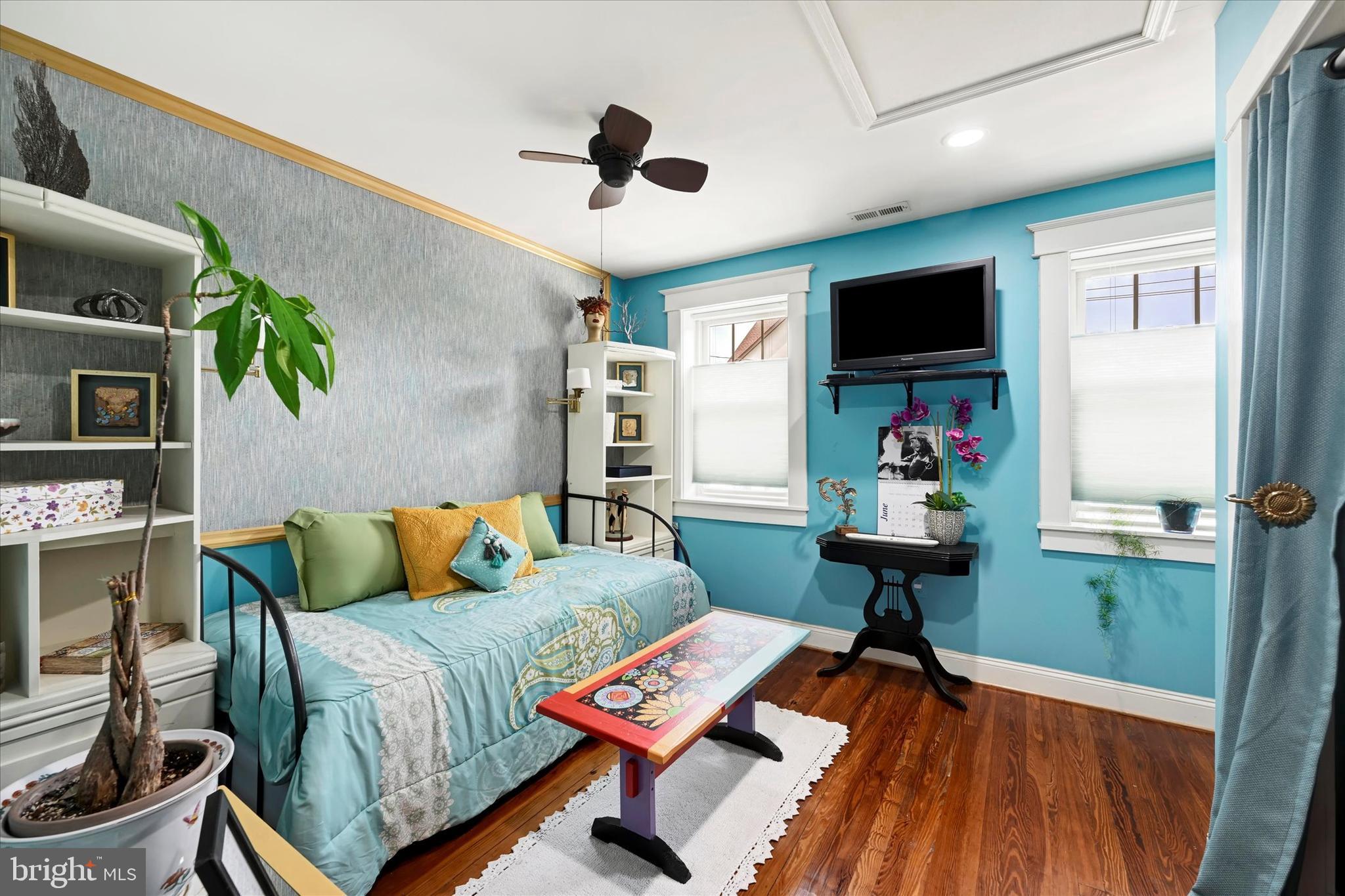 4224 Evans Chapel Road Baltimore, MD 21211 - Photo 16 of 24 a living room with furniture and a flat screen tv