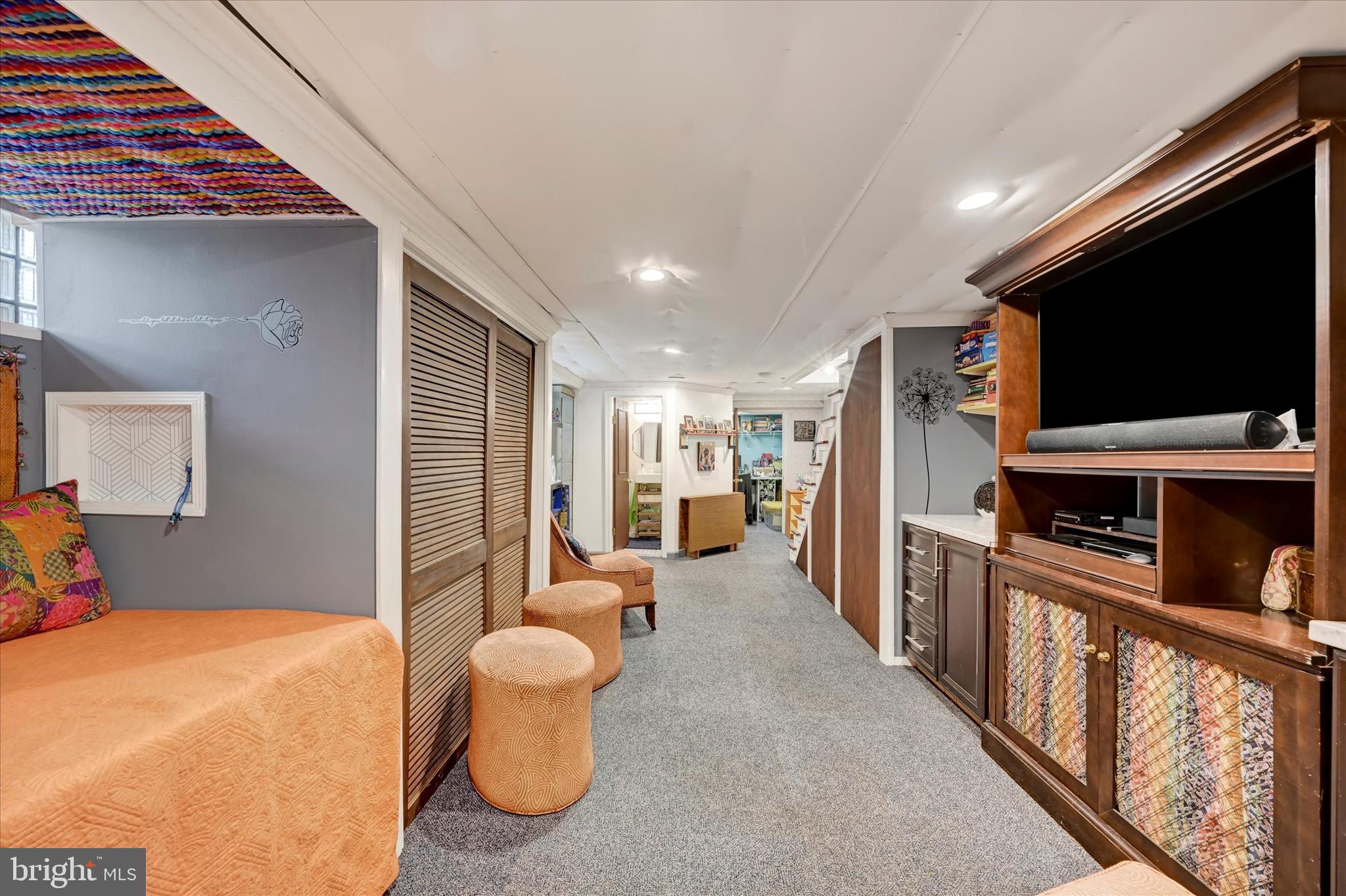 4224 Evans Chapel Road Baltimore, MD 21211 - Photo 18 of 24 a living room with furniture and a flat screen tv