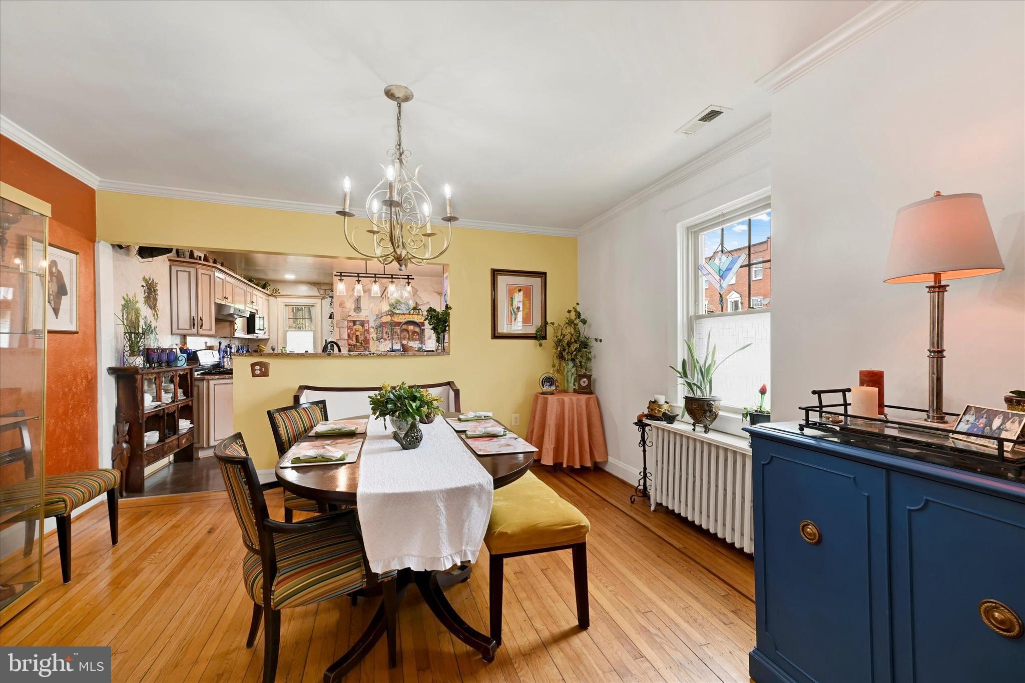 4224 Evans Chapel Road Baltimore, MD 21211 - Photo 7 of 24 a view of a dining room with furniture window and wooden floor