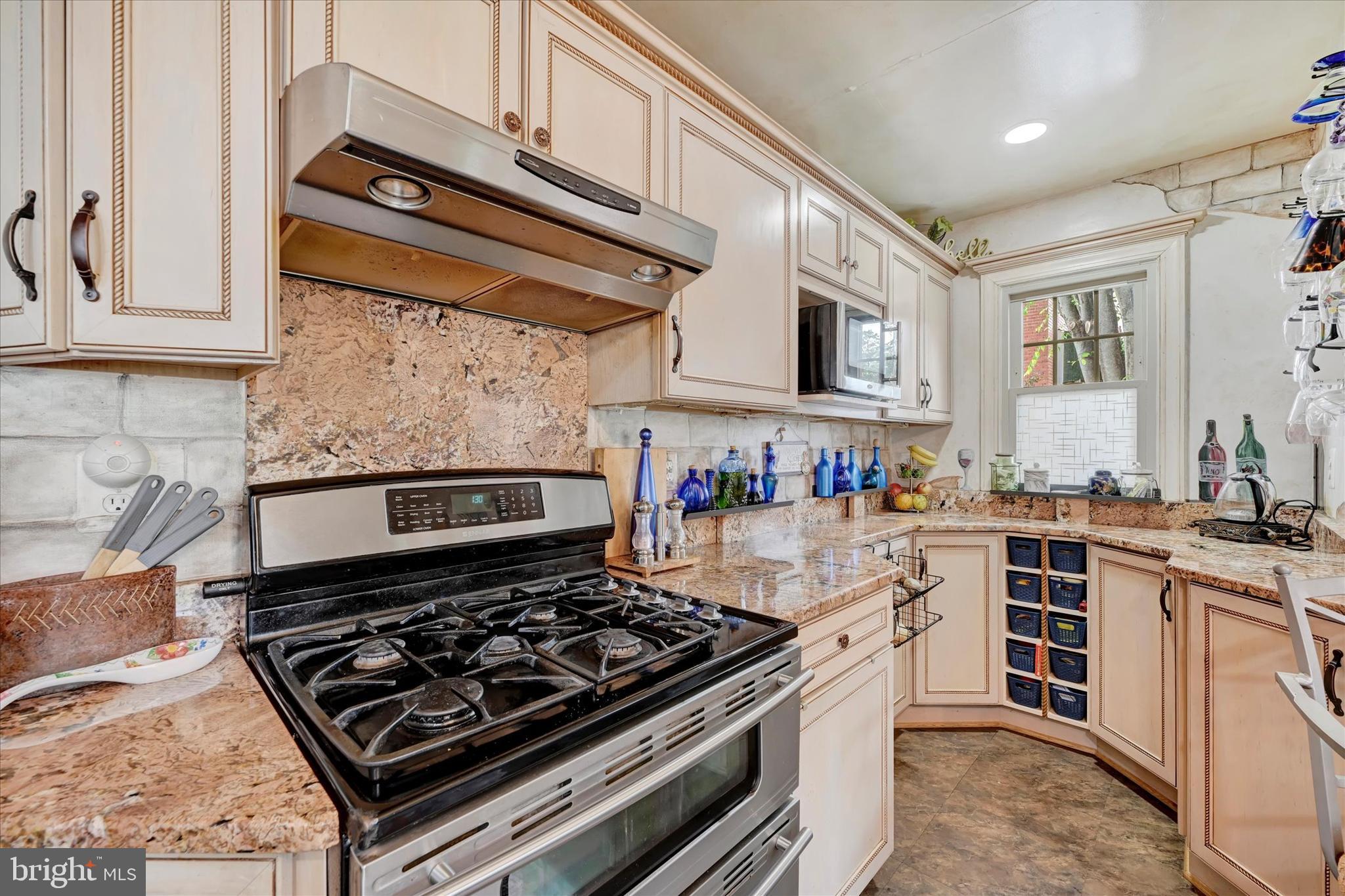 4224 Evans Chapel Road Baltimore, MD 21211 - Photo 9 of 24 a kitchen with stove and cabinets