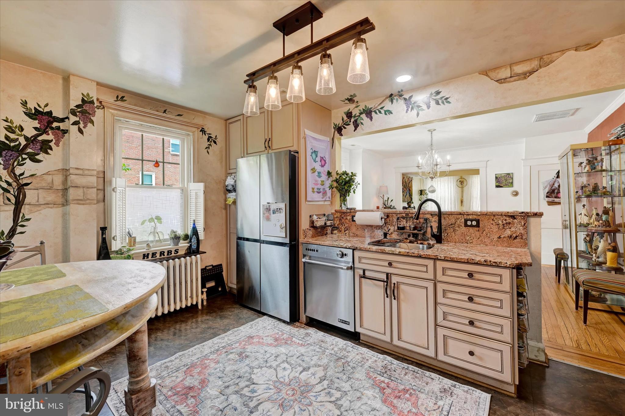 4224 Evans Chapel Road Baltimore, MD 21211 - Photo 10 of 24 a kitchen with a refrigerator and a sink