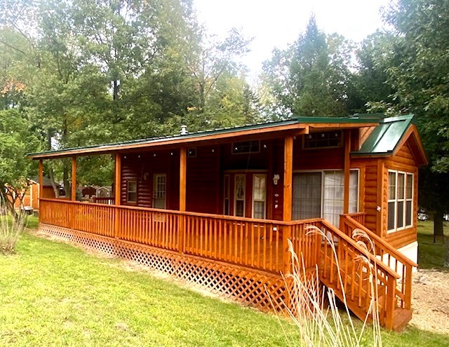 8-90 Woodhaven Sublette, IL 61367 - Photo 1 of 30 a view of a house with a wooden deck