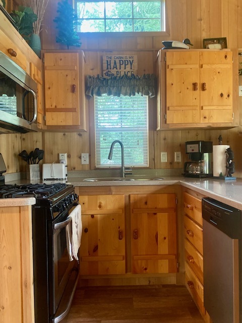 8-90 Woodhaven Sublette, IL 61367 - Photo 17 of 30 a kitchen with stainless steel appliances granite countertop a stove a sink and a microwave