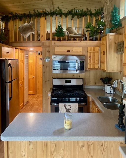 8-90 Woodhaven Sublette, IL 61367 - Photo 18 of 30 a kitchen with a stove a refrigerator and a oven with wooden floor