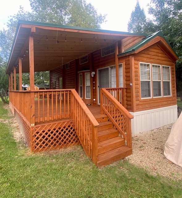 8-90 Woodhaven Sublette, IL 61367 - Photo 2 of 30 a view of a house with a wooden deck