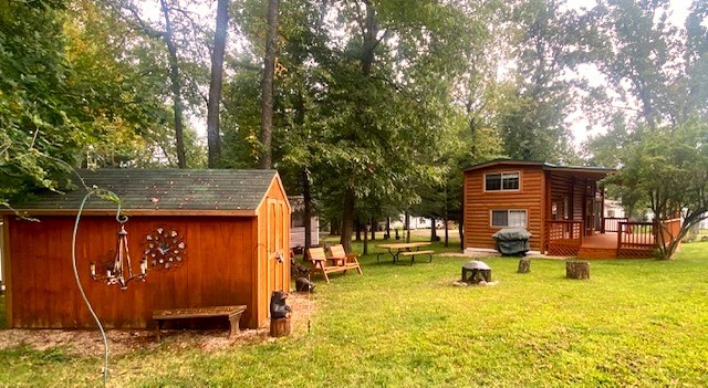 8-90 Woodhaven Sublette, IL 61367 - Photo 9 of 30 a view of swimming pool with outdoor seating and house in the background