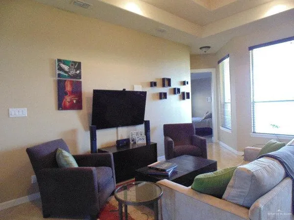 a living room with furniture and a window