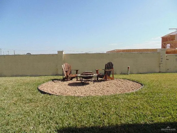 a view of a terrace with a table and chairs